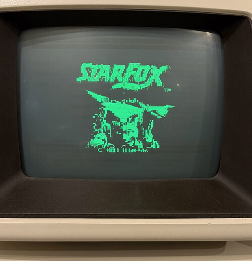 A Commodore 8296 shows a Star Fox title screen in PETSCII characters